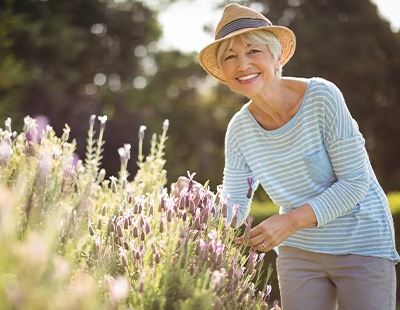 Older woman outside enjoying her new smile